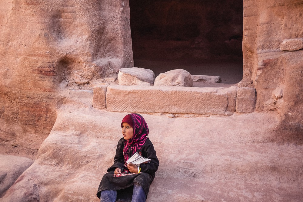 Young girl selling books in Petra