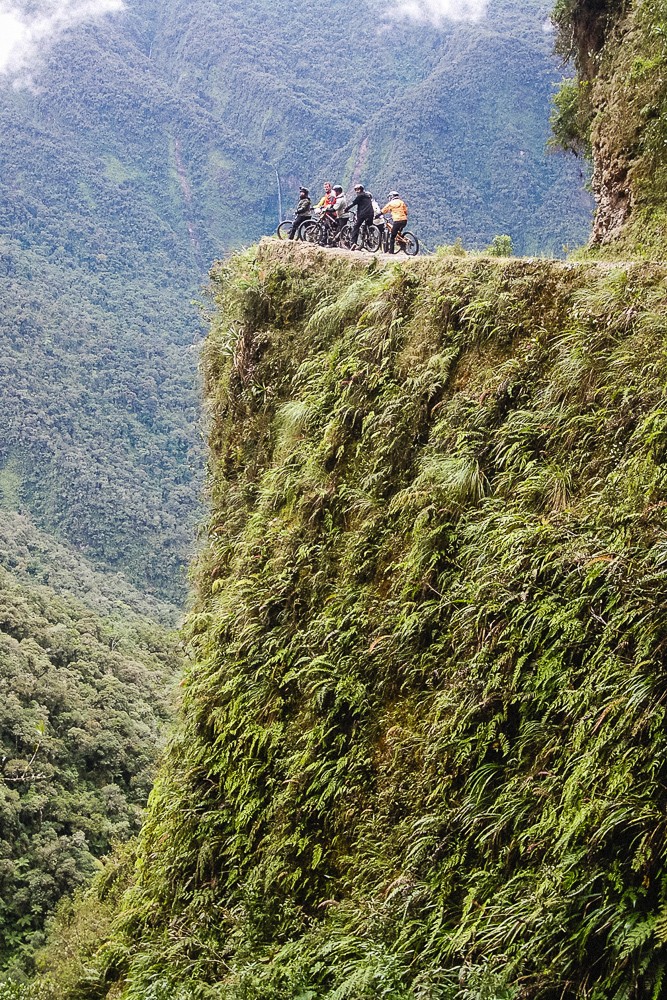 Standing Over Cliff Edge On Death Road In Bolivia