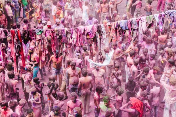 Locals and Tourists Throwing Colored Powders during Holi In Pushkar India