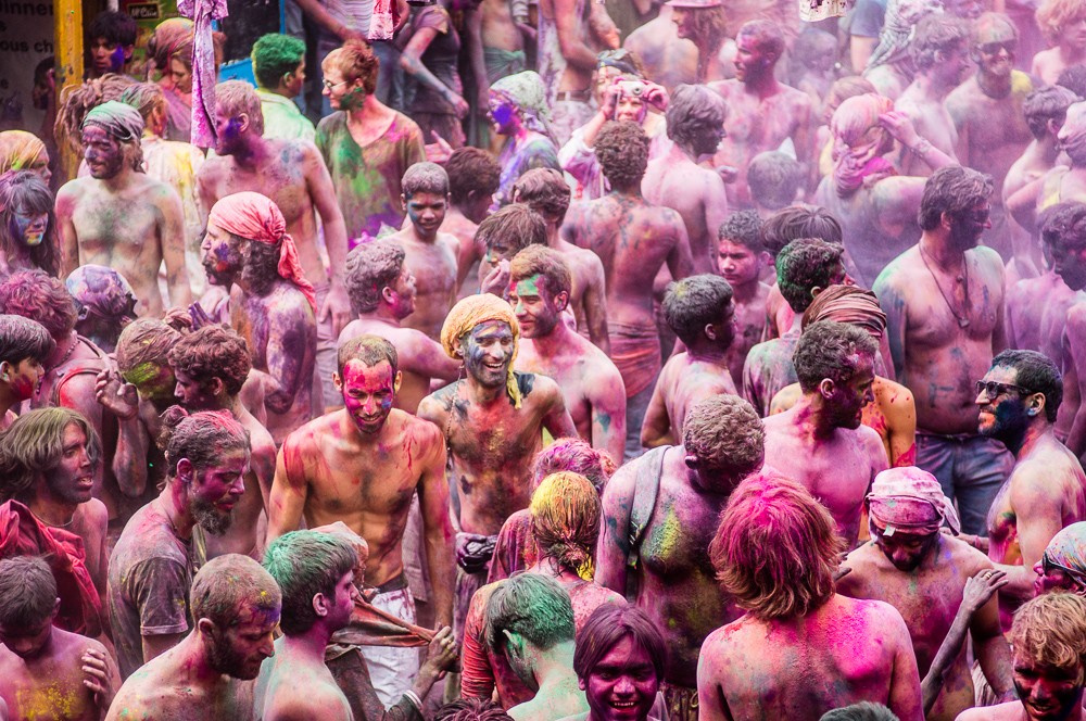 Locals and Tourists Throwing Colored Powders during Holi In Pushkar India