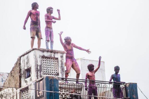 Locals and Tourists Dancing On Roof During Holi In Pushkar India