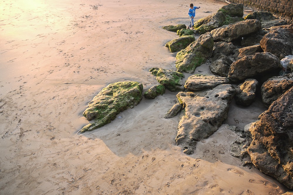 Child Playing On Beach In Essaouira Morocco