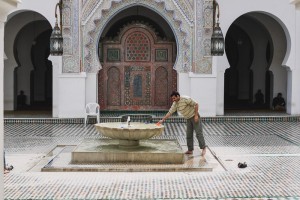 Man Cleaning Himself In Fes Mosque