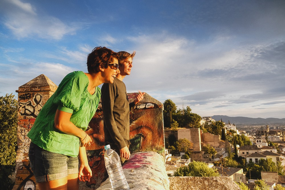 Friends watching the sunset in Granada, Spain