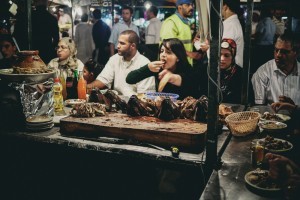 Woman Enjoying Lamb From Stall In Jamaa El Fna