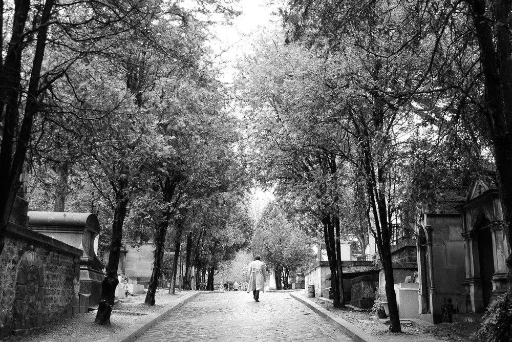 Man Walking In Pere Lachaise Cimetiere in Black and White