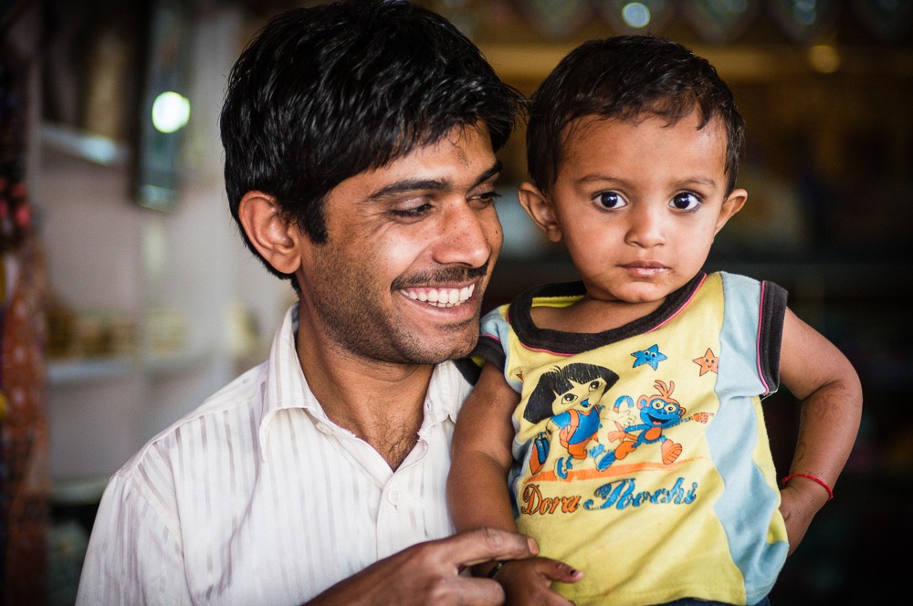 India Shopkeeper Portrait With Son