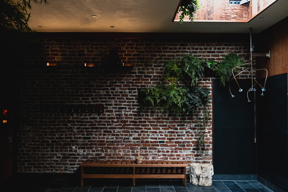 Hanging Plants On Brick Wall at Onsen SF