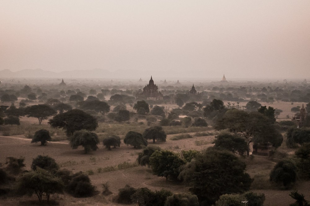 Hazy sunrise over pagodas in Bagan