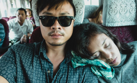 Travelers sleeping on bus