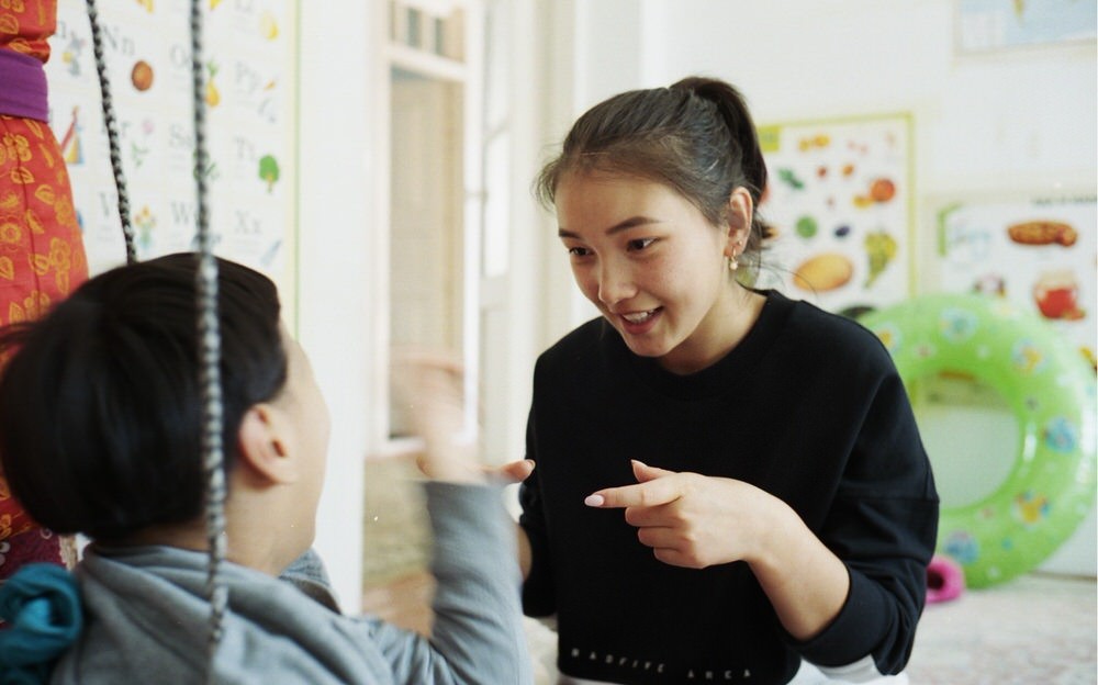 Young Kyrgyz Girl Plays With Her Sister