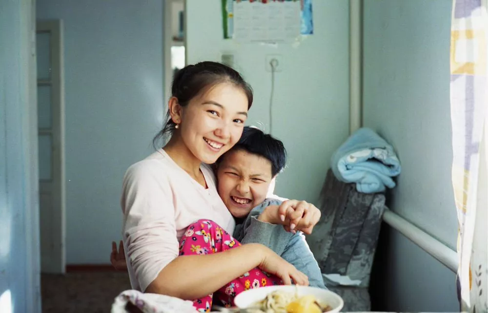 Kyrgyz Girl Sits With Her Disabled Sister