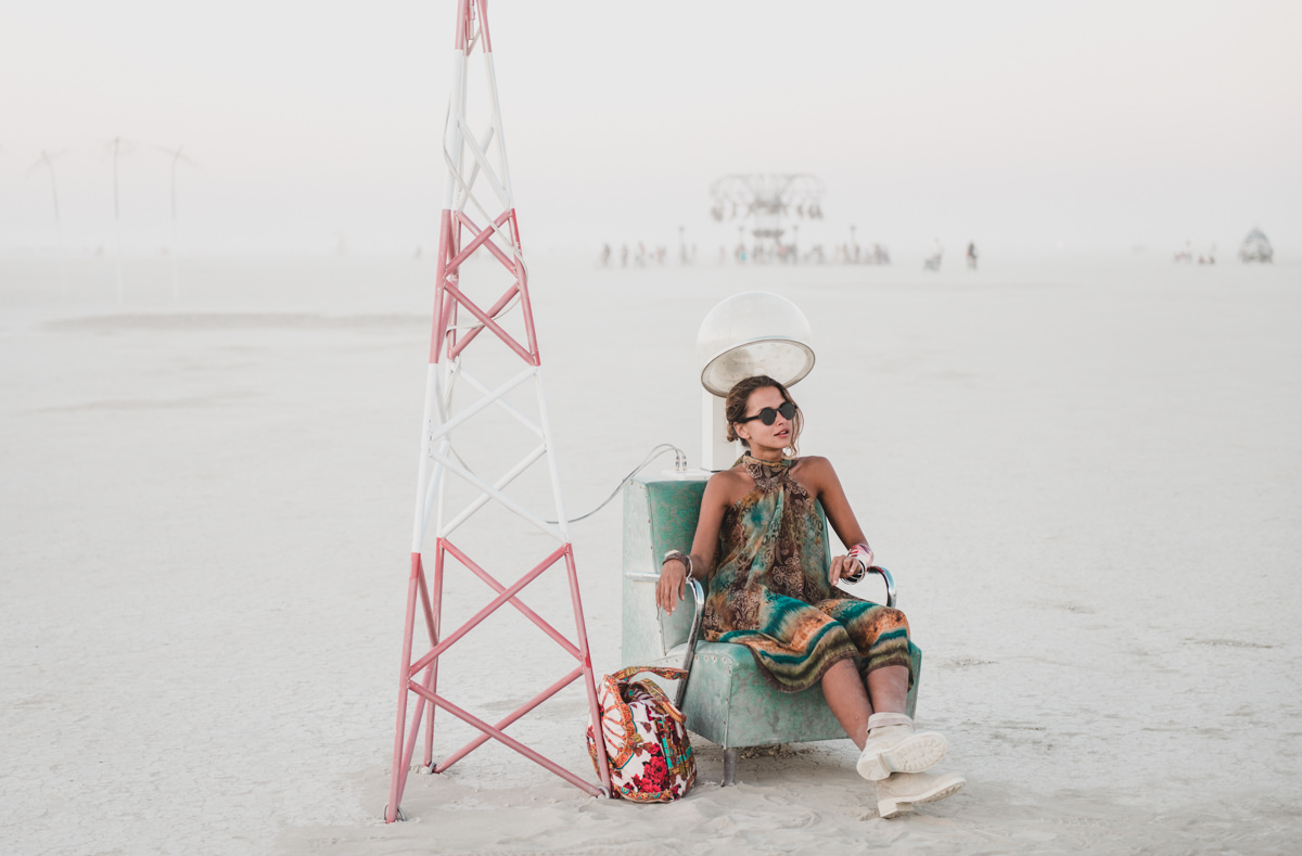 Girl Sitting At Hair Dryer Installation Burning Man Playa