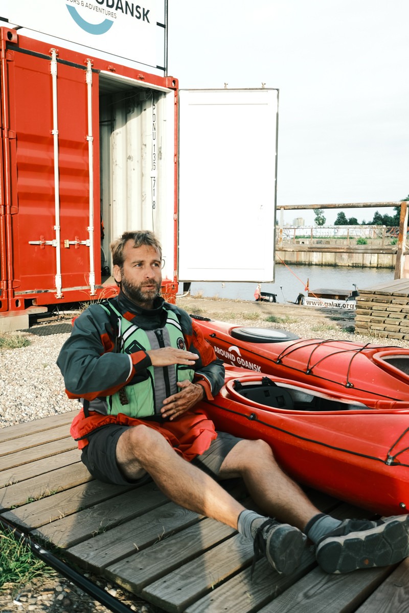 Szymon showing how to sit in kayak around gdansk