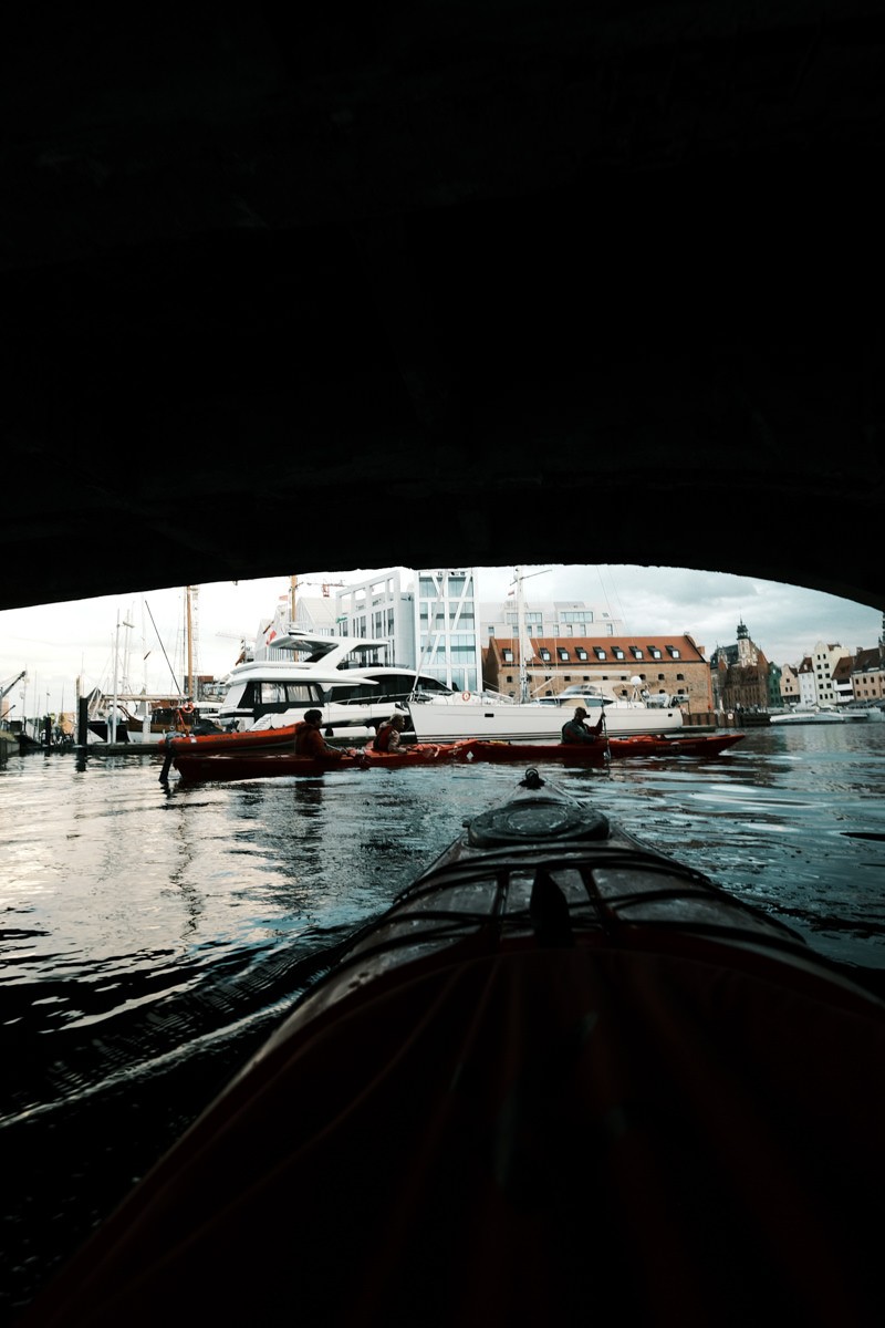 Kayak going under Gdansk bridge