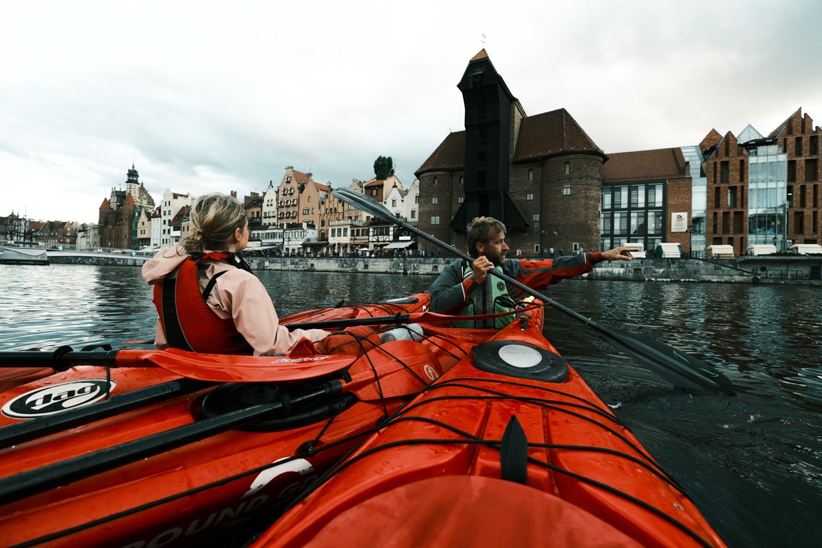 Kayakers in front of Crane Gate in Gdansk