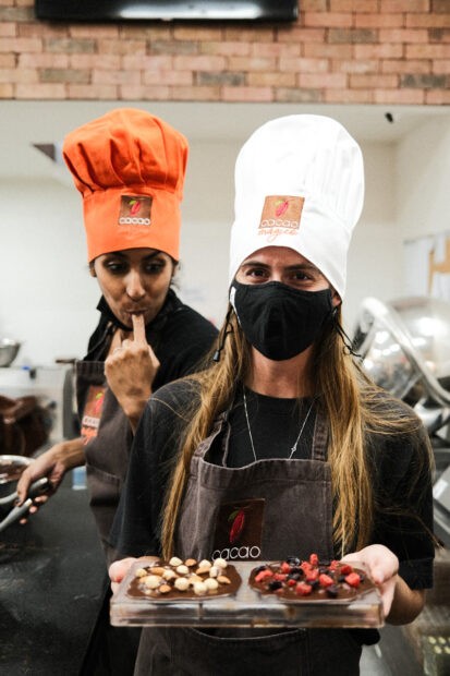 Woman holding chocolate mold at Cacao Magico