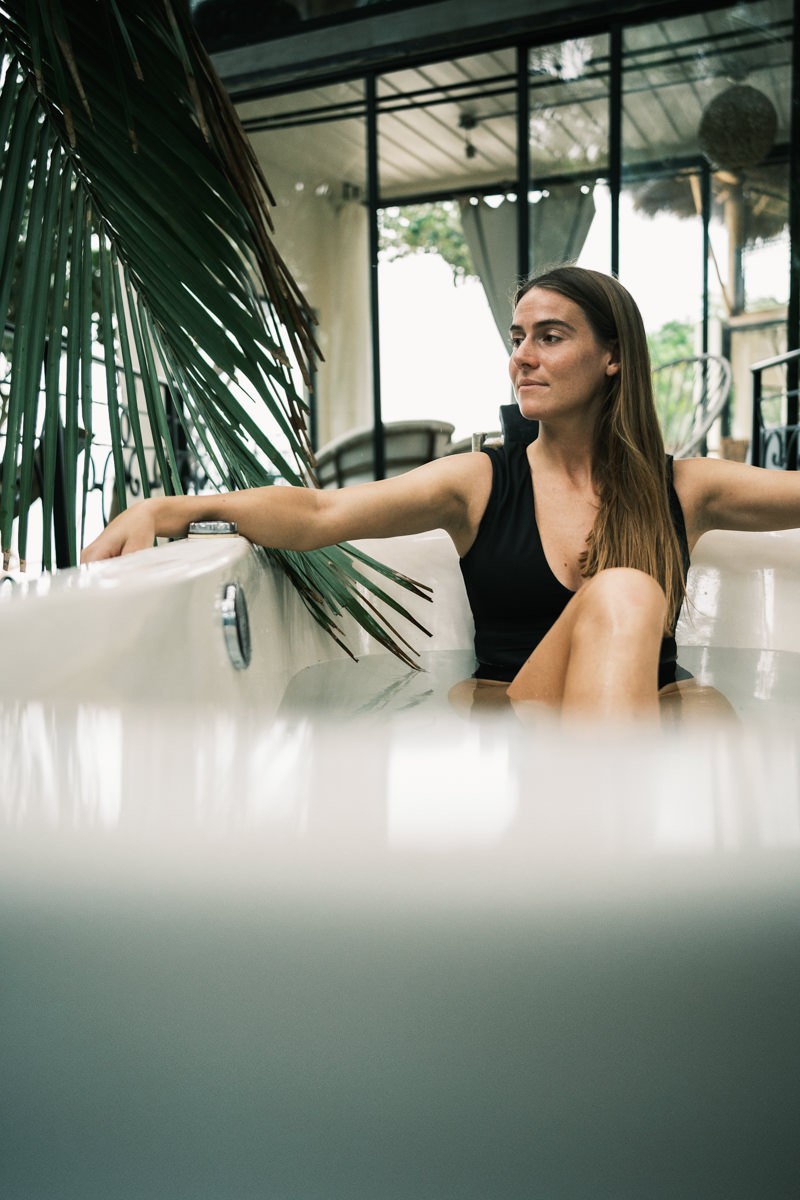 Woman in outdoor jacuzzi tub at Amor Eterno Villa in Sayulita