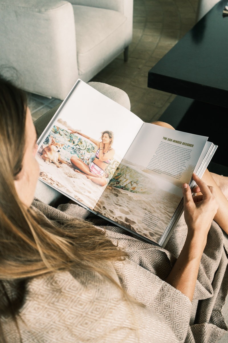 Woman reading surf magazine in Sayulita