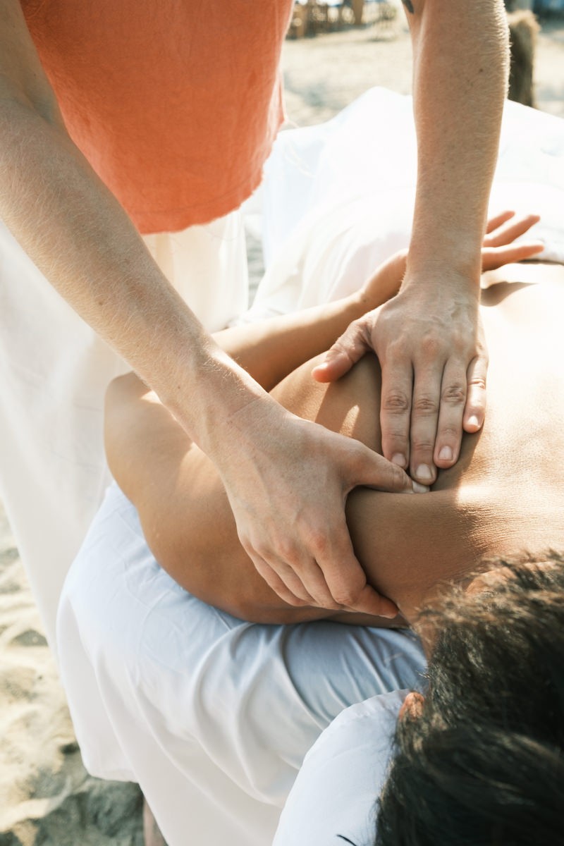 Massage therapist working on shoulder in Sayulita