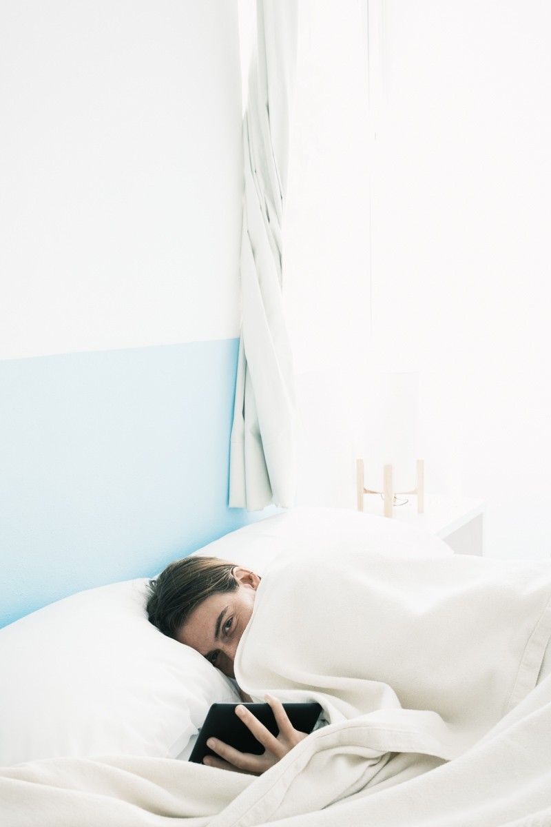 Girl in bed at Azul Pitaya Hotel in Sayulita