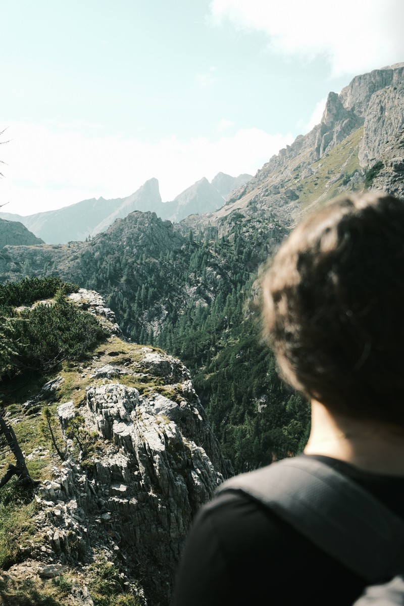 View of Dolomites over shoulder of hiker shot on Fujifilm X-T4