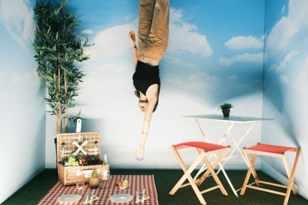 woman in upside picnic installation pink palace wow porto