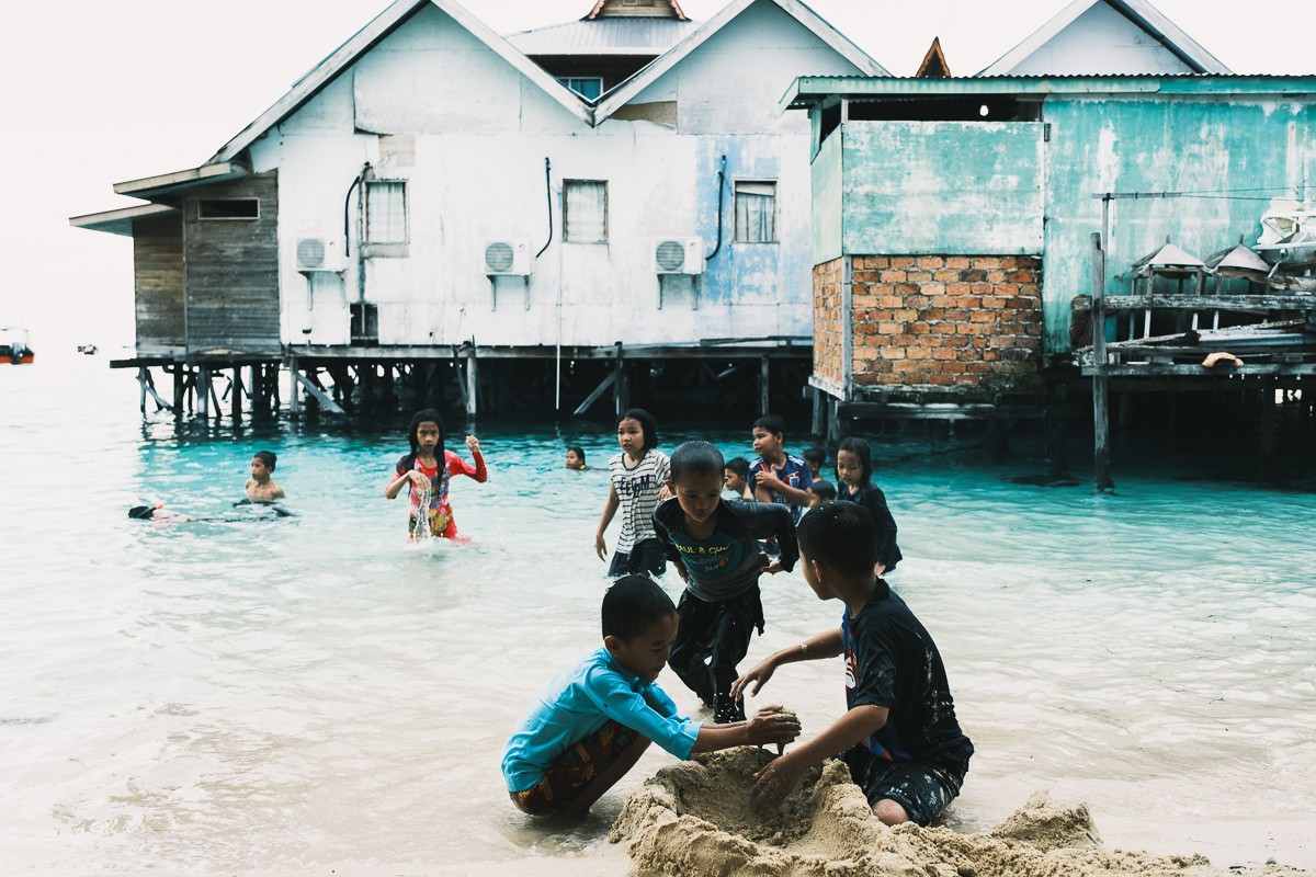 Children playing in the water on Mabul Island