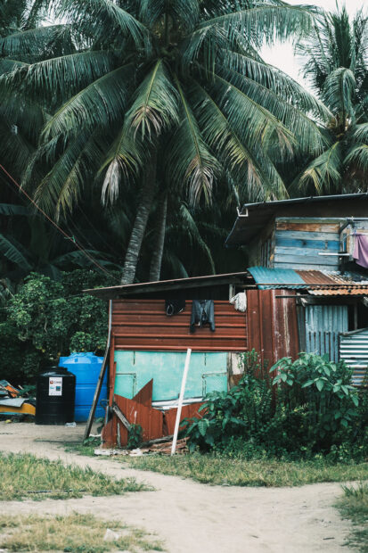 Shack with corrugated metal sheet walls on Mabul Island