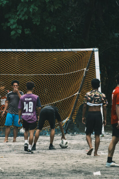 A group of men playing football on Mabul Island