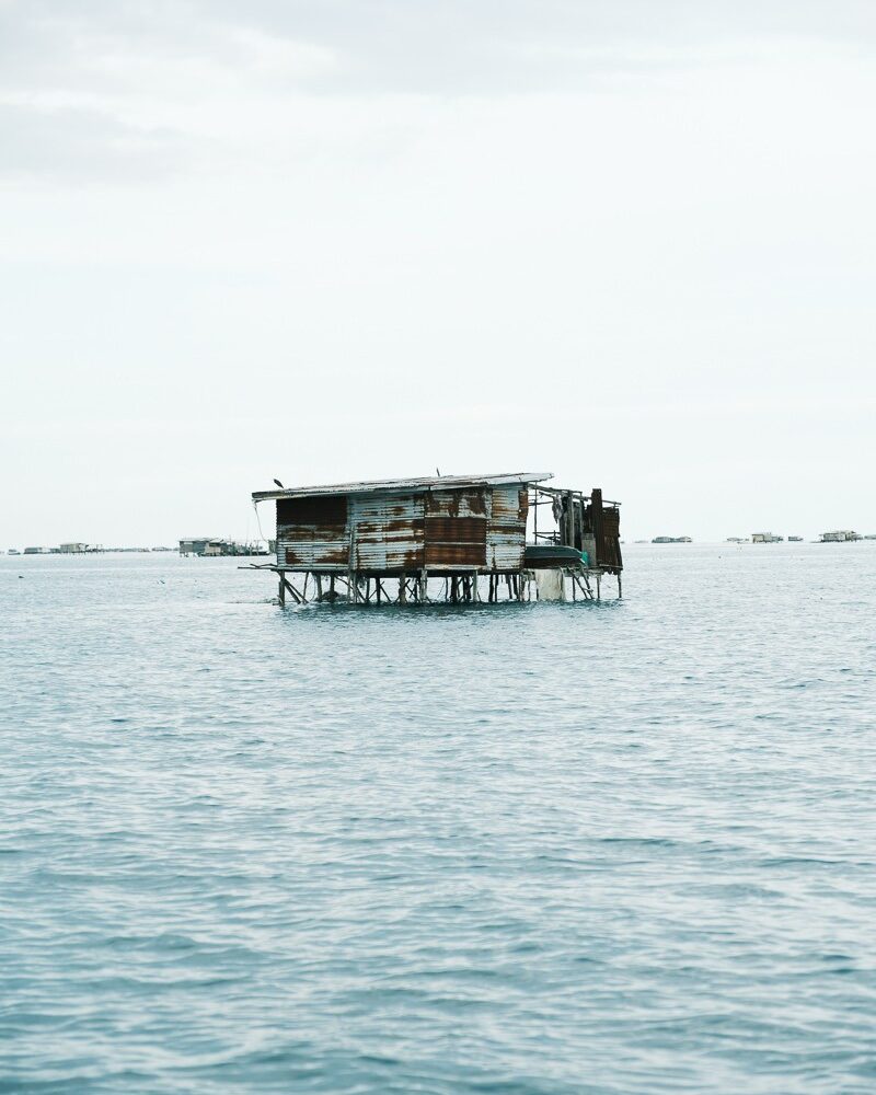 Water shack on stilts in the middle of ocean Sabah Borneo