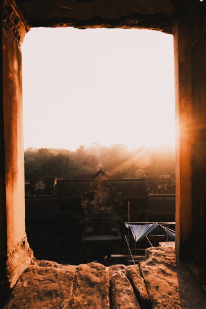 Sunrise through a framed window at Angkor Wat