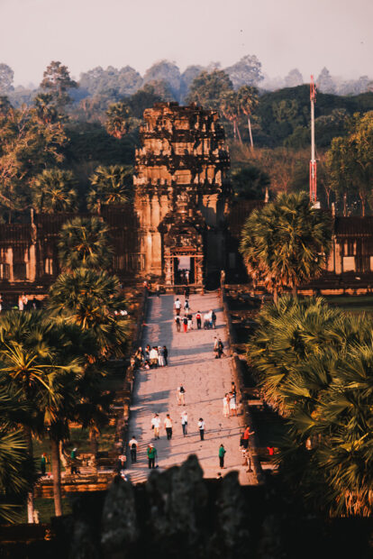 Busy walkway in front of angkor wat after sunrise
