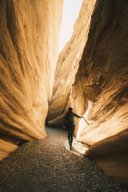 Hiker standing in Anniversary Narrows Slot Canyon