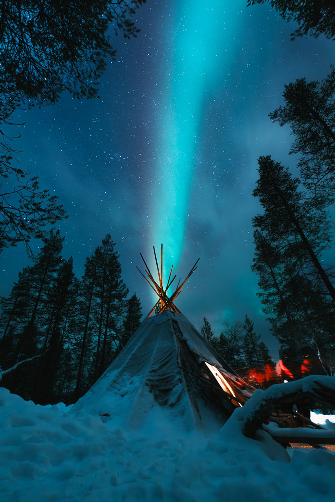 Northern lights over teepee in Finland Lapland Saariselka