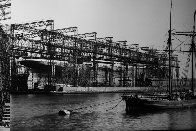 Historical photograph showing the Arrol Gantry holding the Titanic during construction