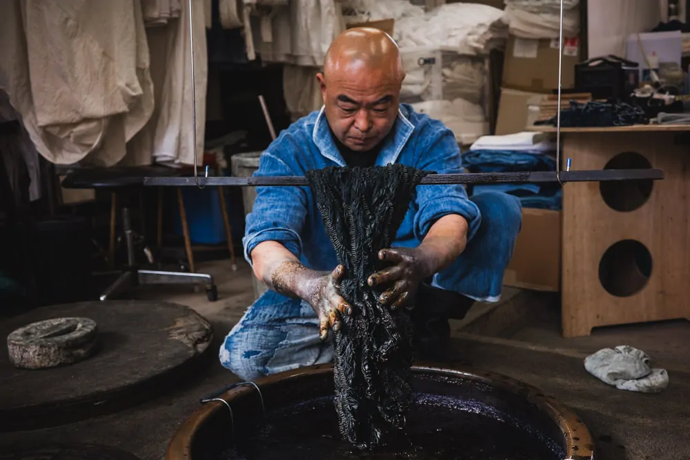 Toru Shimomura working with indigo dye