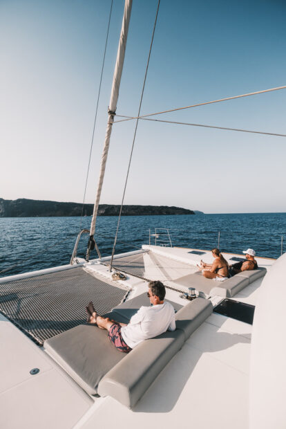 People sitting on Sunset Oia Ipanema 58 Catamaran