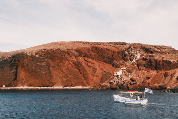 Boat anchored off Red Beach in Santorini