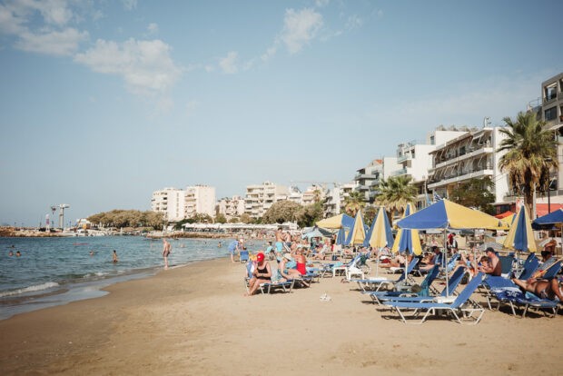 Nea Chora beach in the afternoon with beach umbrellas