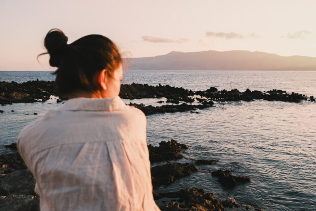 Girl watching sunrise at Kissamos Port