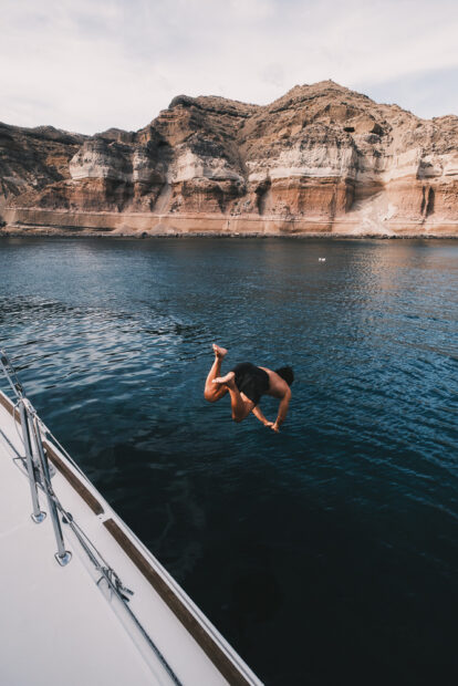 Man diving into Aegean Sea at Mesa Pigadia aboard Vista Yachting Sunset Cru9ise
