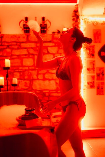 Girl blowing bubble at Beer Spa in Prague