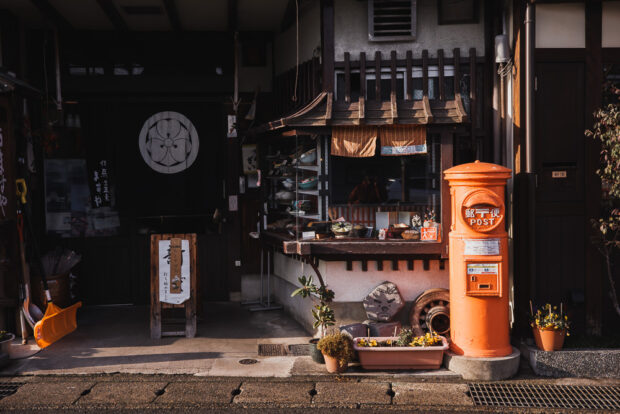 Kinosaki Onsen street wit old post mailbox receptacle