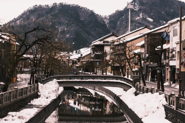 Snow covered bridge over the Otani River in Kinosaki Onsen