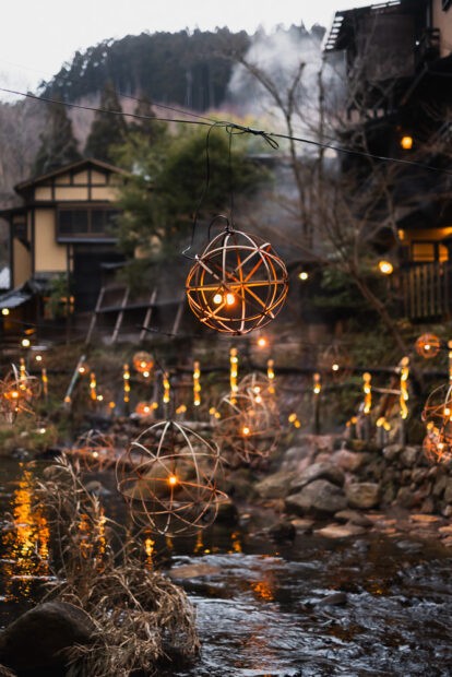 Lanterns over Tanoharu River at night at Kurokawa Onsen