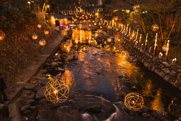Lanterns over Tanoharu River at night at Kurokawa Onsen