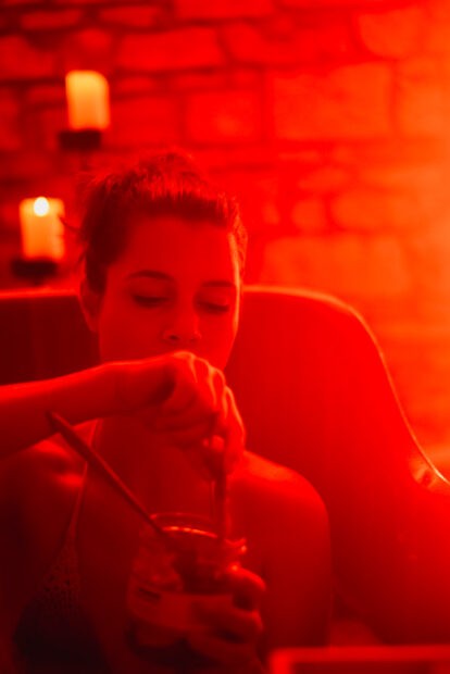 Girl eating Czech pickled cheese at beer spa