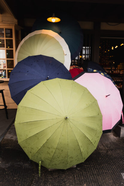 Colorful umbrellas outside shop in Yufuin
