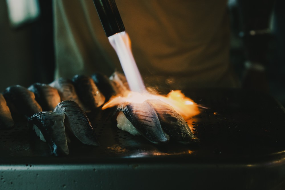 Blow torch over sardines at Chefs on Fire Cascais
